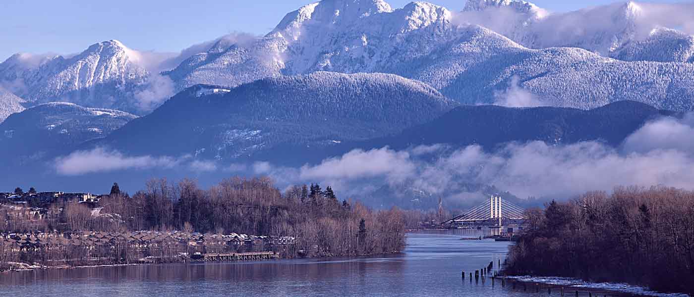 Fraser River in BC with snow capped mountains behind