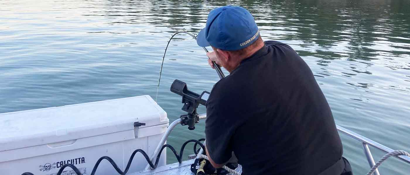 Man fishing with sturgeon fishing equipment