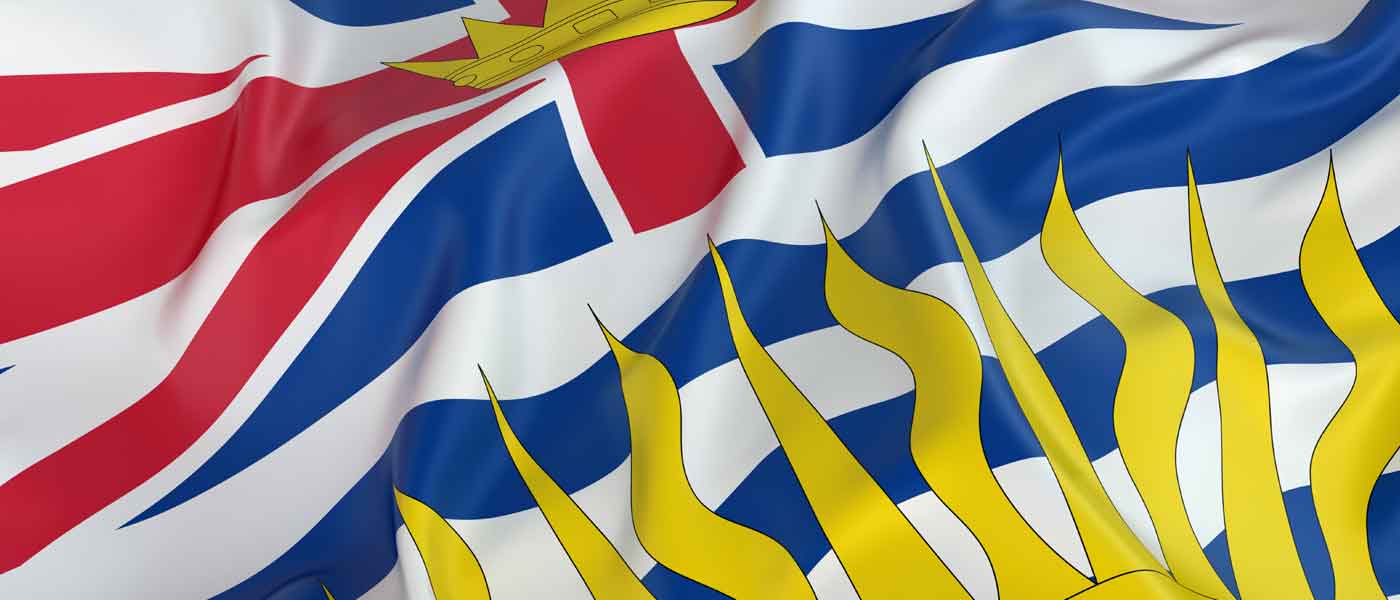 British Columbia, a Must-Visit Fishing Destination, boasts rich waters and scenic beauty, symbolized by its flag rippling proudly in the wind.